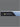 Close-up side profile of the Serta Antarctic mattress border displaying the black and light blue two-tone design with All-Night Cooling Powered by Cooltex branding