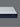 Corner angled view of Serta Classic Luxury mattress showcasing white bubble-tufted sleep surface and deep navy blue tie-dye floral-pattern side border