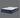 Full angled view of Serta iComfort Eco mattress displaying white geometric star-quilted pillow-top and navy blue quilted base with brand label on a grey background