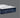 Corner close-up of Serta iComfort Eco mattress highlighting the white geometric-quilted pillow-top layer and deep navy blue quilted base with iComfort Eco brand label