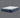 Full angled view of Serta iComfort mattress displaying white and navy blue swirl-patterned pillow-top and deep navy blue quilted base with iComfort brand label