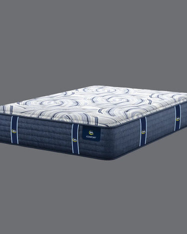 Full angled view of Serta iComfort mattress displaying white and navy blue swirl-patterned pillow-top and deep navy blue quilted base with iComfort brand label