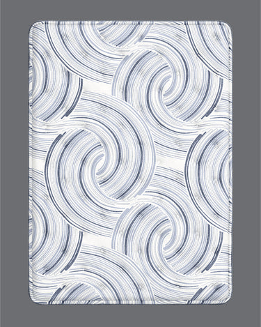 Corner close-up of Serta iComfort mattress highlighting the white and navy blue swirl-patterned pillow-top and deep navy blue quilted base with iComfort brand label