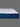Side profile view of the Serta iLatex mattress showcasing its thick white tufted pillow top and deep navy blue wave-patterned quilted border