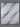 Top-down view of the Serta iLatex mattress surface showing a tufted white and blue diagonal stripe fabric pattern across the full sleep surface