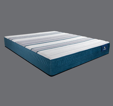 Angled full view of the Serta iPedic mattress displaying its white and blue striped top panel with teal quilted side border