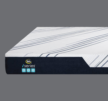 Angled top view of Serta iSeries mattress showcasing white diagonal navy and grey striped cooling fabric surface and deep navy blue base with iSeries cooling icons label